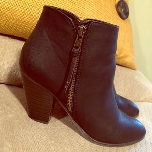 Black booties, thick heel.